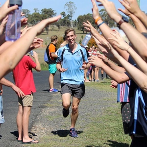 Bachelor of Science (Genetics) student Dominic Waters completes fun run beneath canopy of hands