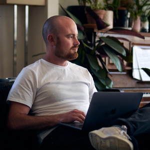 Bachelor of Arts student Harrison Munday studies on his laptop at home