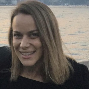 Bachelor of Psychological Science student Daina Sinozic in black jacket with Sydney Harbour Bridge