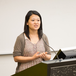 UNE urban and regional planning student speaks at lecturn
